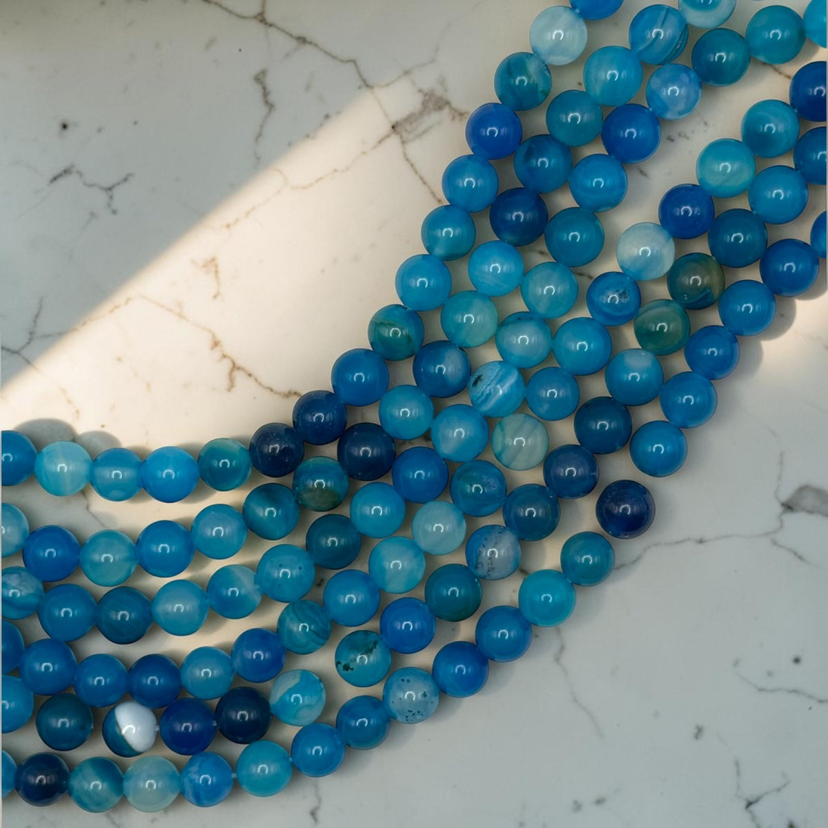 Striped blue agate bead strands for rosary making