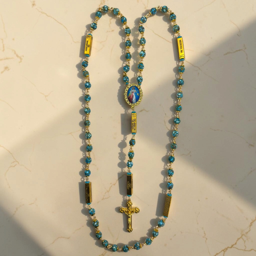 Gold and turquoise Divine Mercy guided mystery rosary with turquoise beads, gold mystery bars, Divine Mercy centerpiece, and gold crucifix