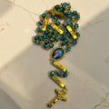 Coiled gold and turquoise Divine Mercy guided mystery rosary showing engraved mystery bars, Divine Mercy centerpiece, and gold crucifix