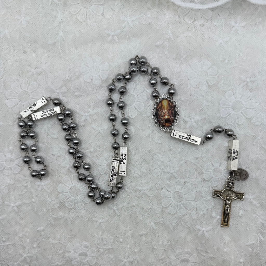 Silver Nativity and hematite rosary, detailed layout