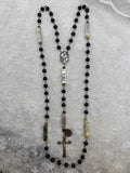 Full view of silver and black wood guided mystery rosary