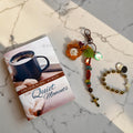 Fall Encouraging Words Catholic gift set with devotional book, gold decade bracelet, and autumn keychain