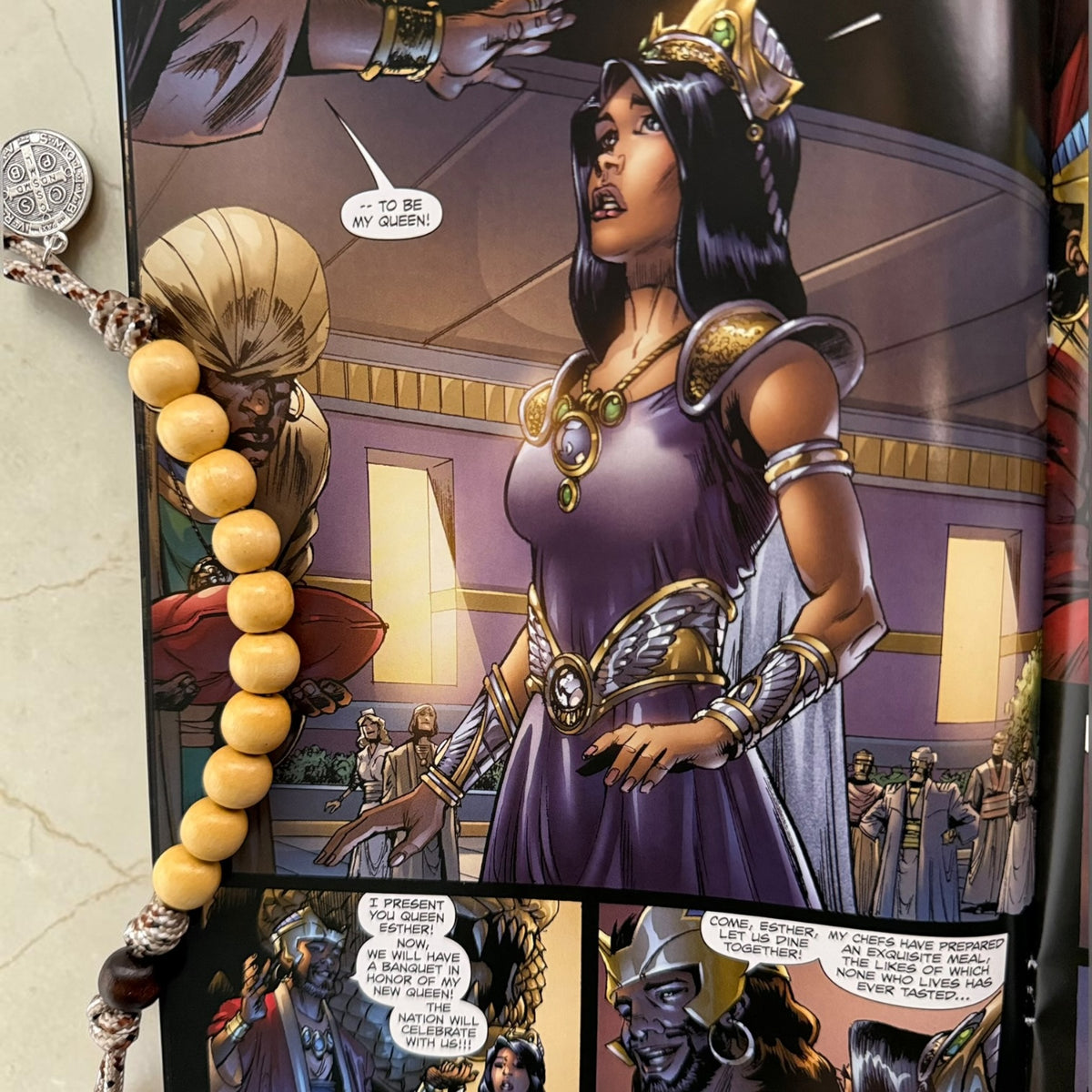 Esther comic book close-up interior artwork with wooden St. Benedict decade rosary