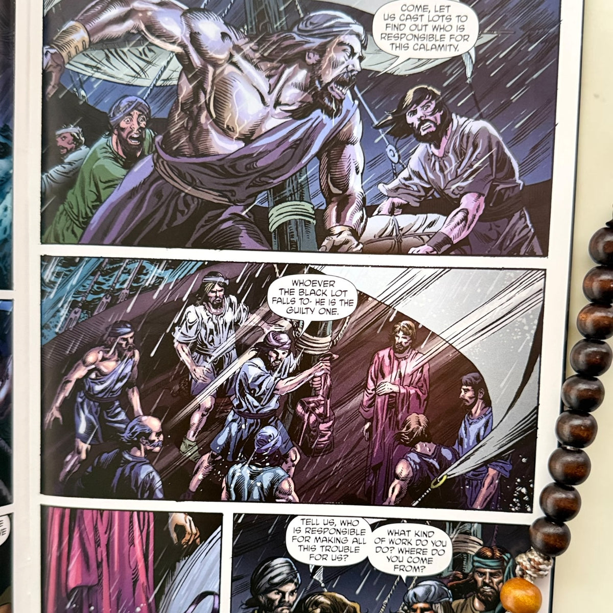 Jonah comic book close-up interior artwork with wooden St. Benedict decade rosary