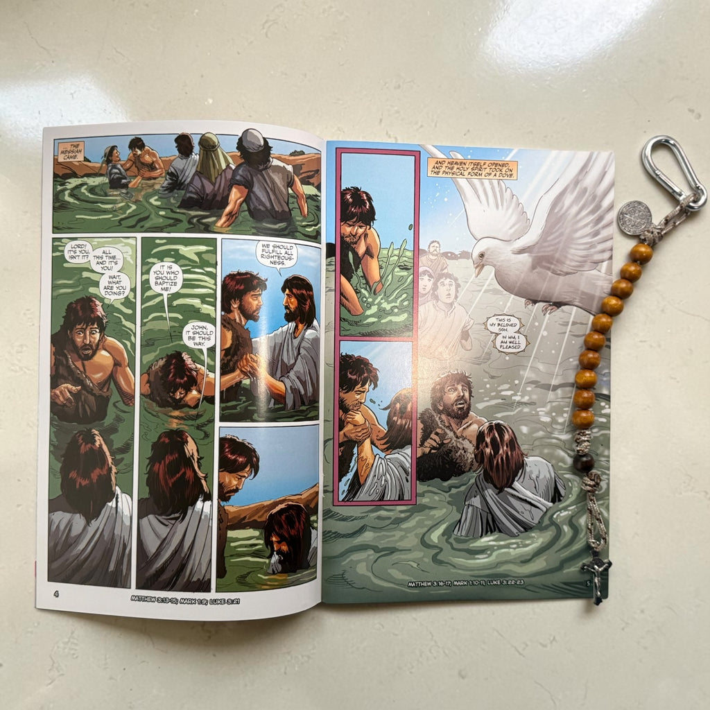 The Christ Volume 3 comic book open to the baptism of Jesus with wooden St. Benedict decade rosary