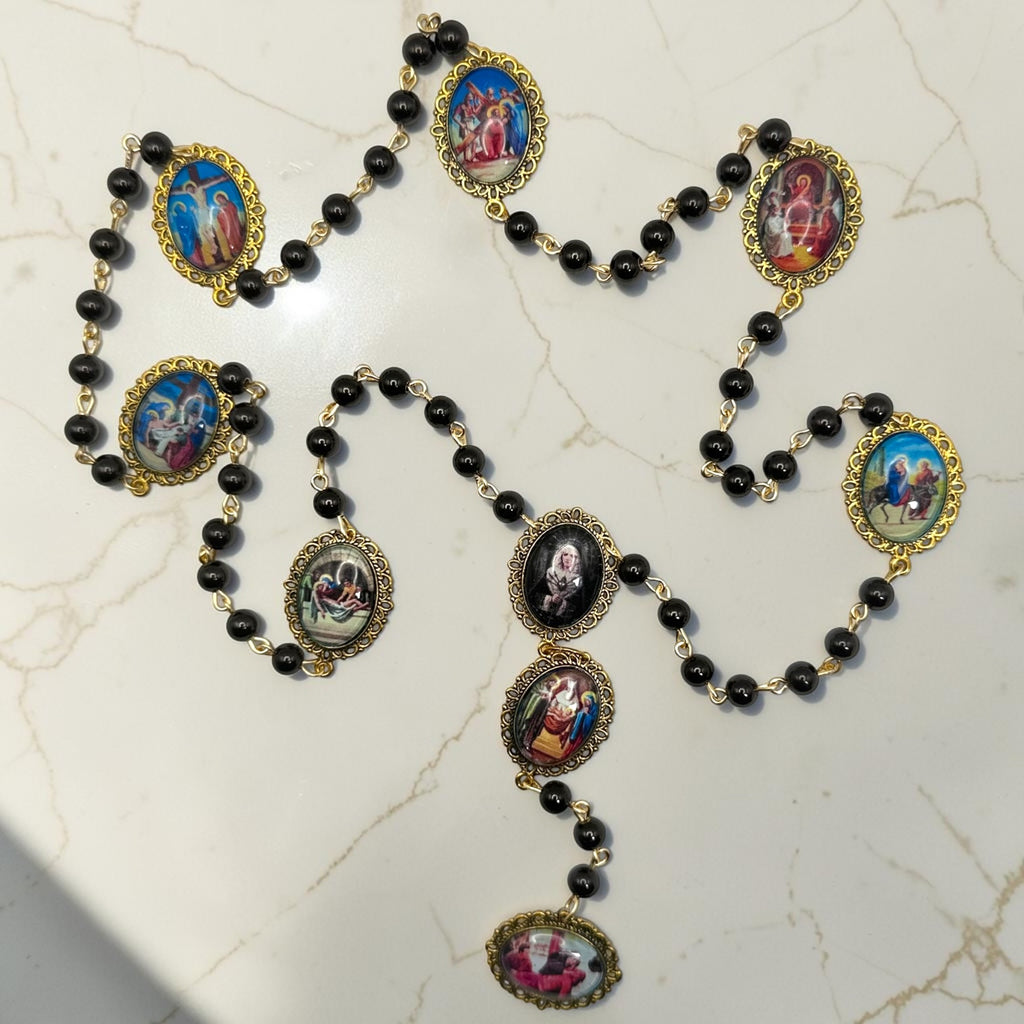 Gold Our Lady of Sorrows chaplet with black beads and cabochon glass meditation images