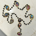 Gold Our Lady of Sorrows chaplet with black beads and cabochon glass meditation images