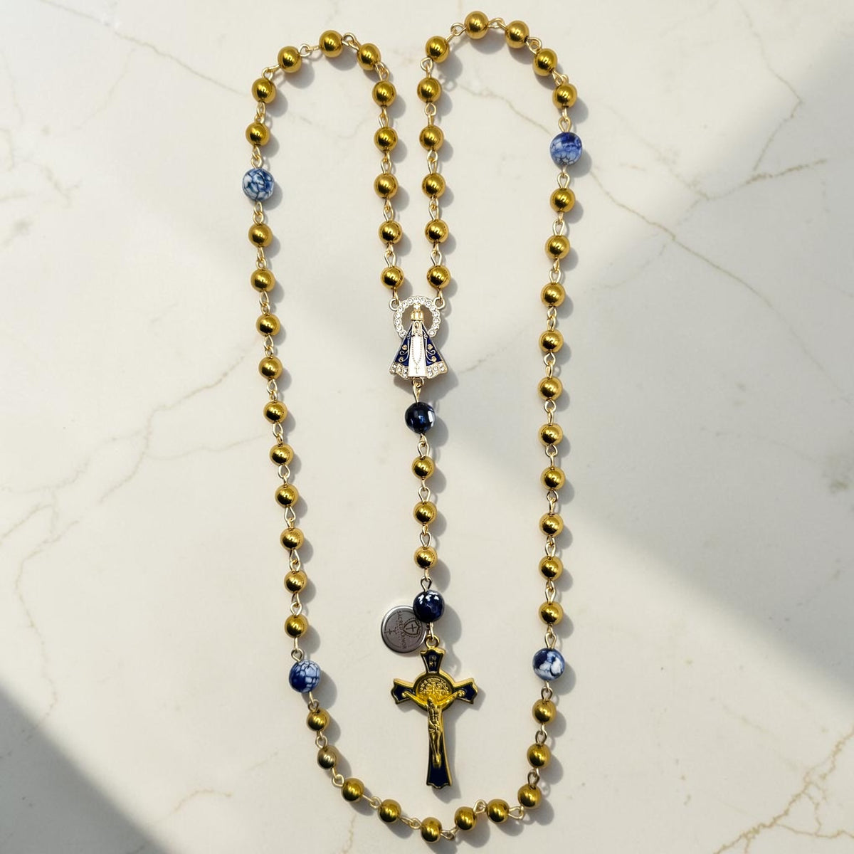 Gold and royal blue Our Lady Aparecida rosary with gold beads and blue accent beads