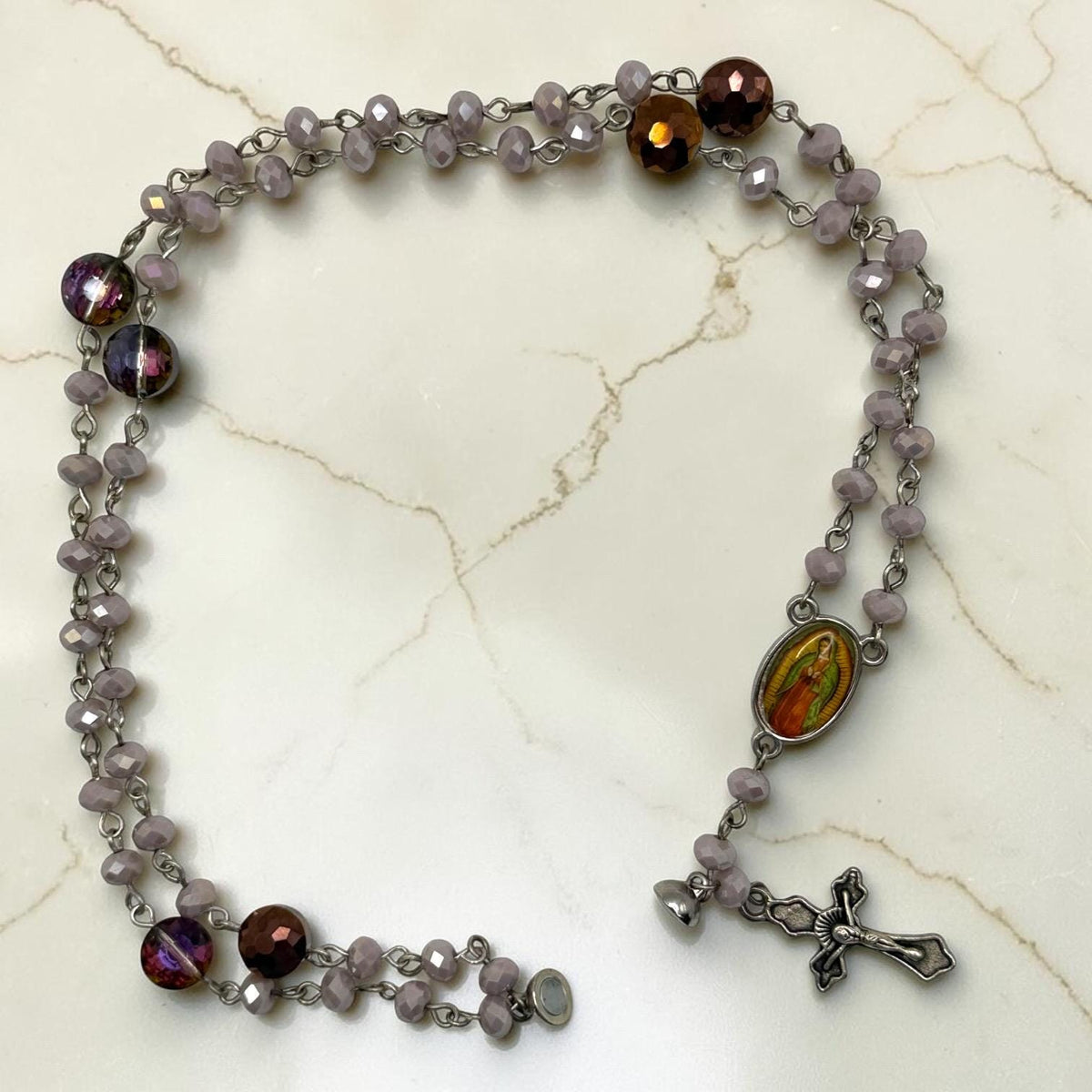 Purple Crystal magnetic rosary bracelet unwrapped view