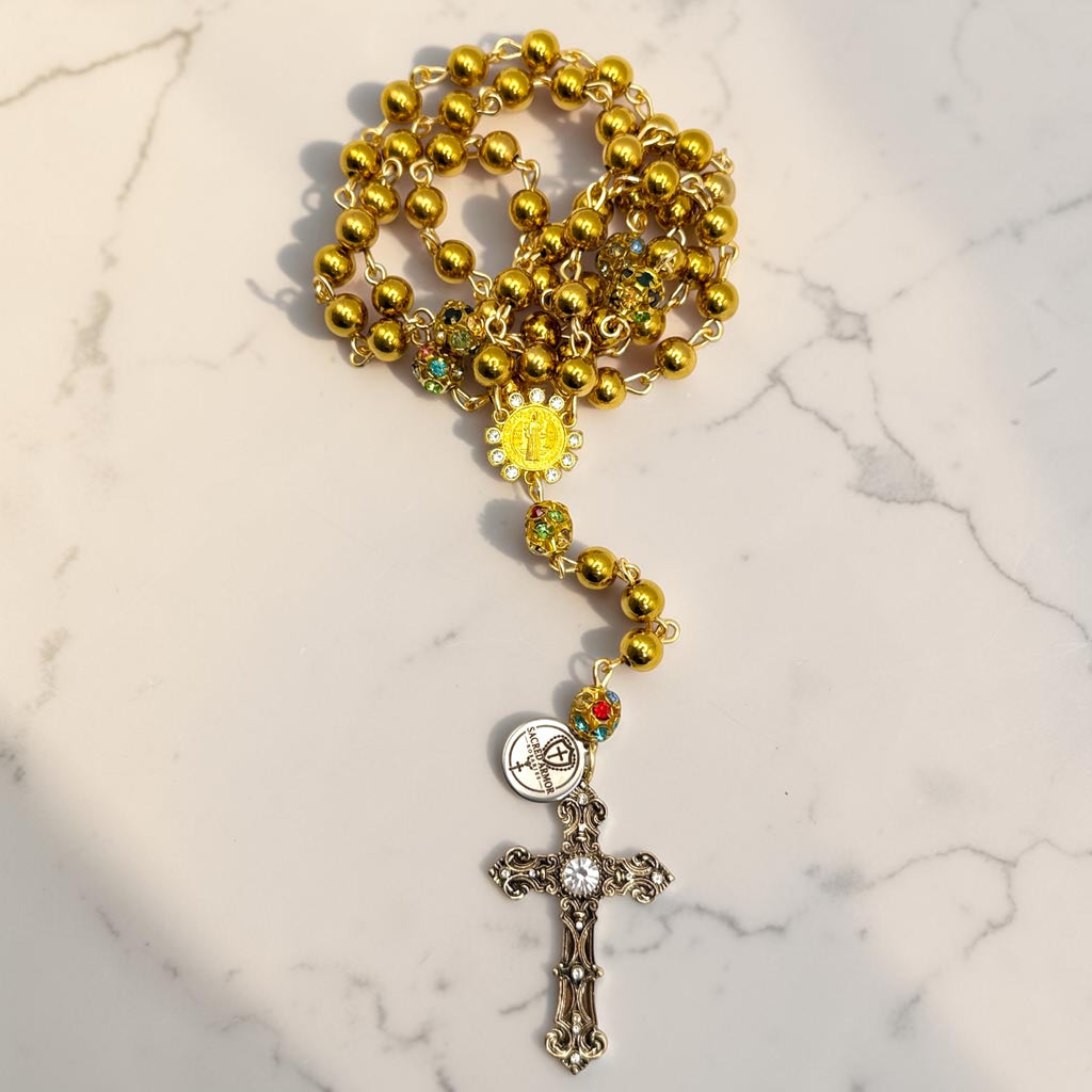 Gold and crystal Saint Benedict rosary arranged view