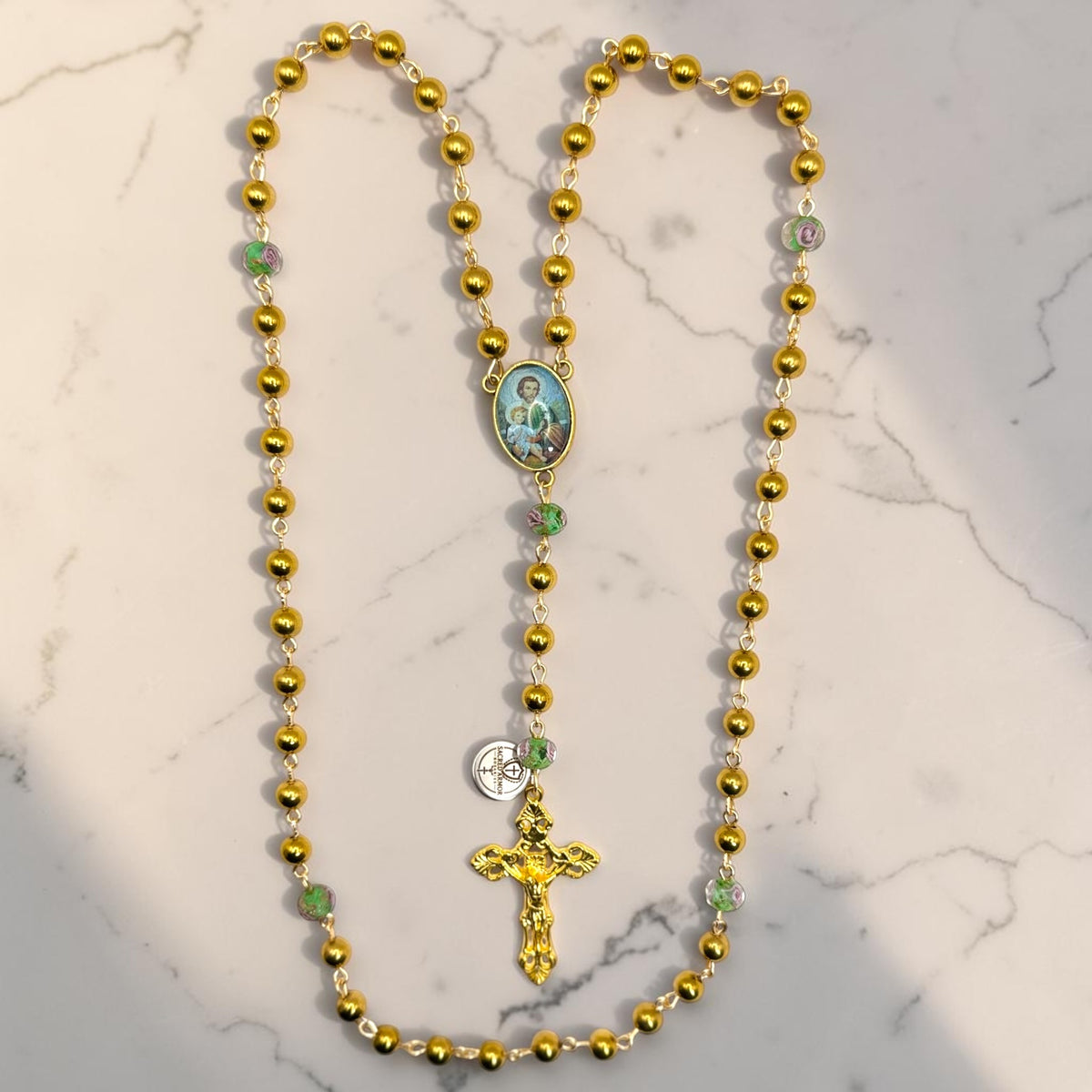 Gold Saint Joseph rosary with floral glass accent beads full view