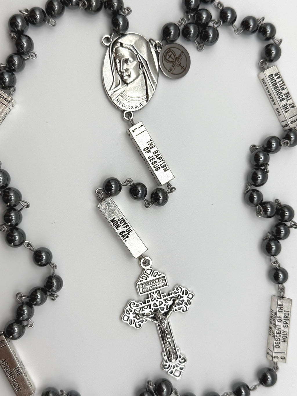 Guided Mysteries Black Hematite Rosary engraved bead detail