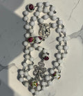 White Floral Rosary with St. Michael centerpiece and ornate crucifix