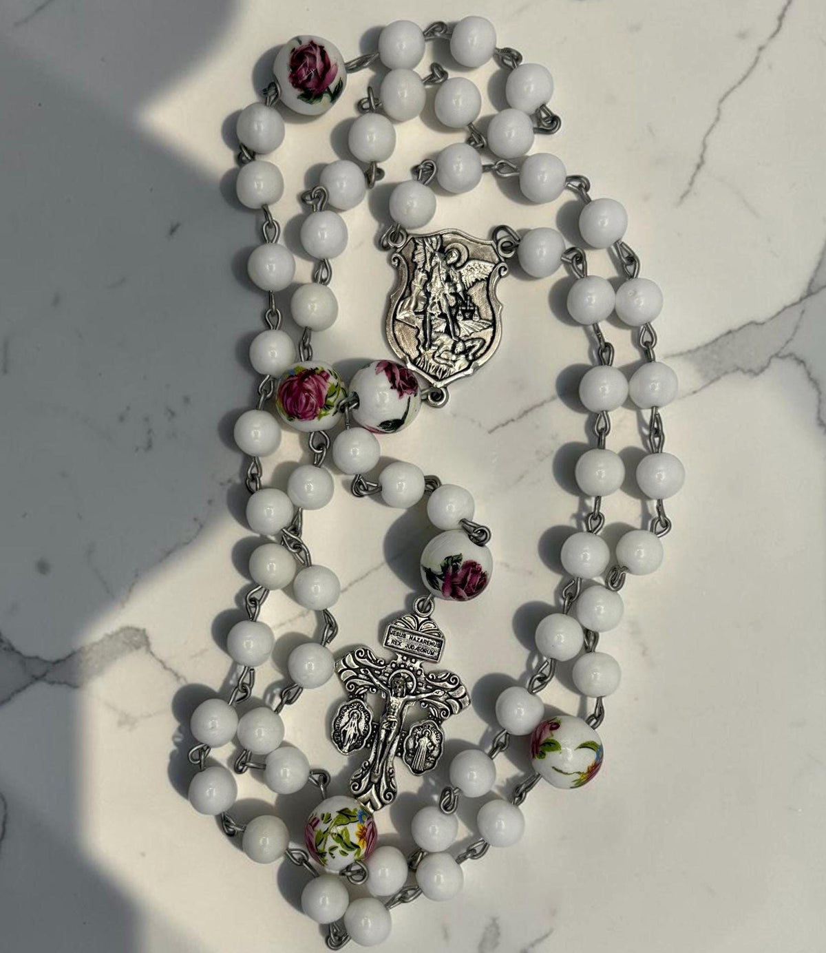 White Floral Rosary with St. Michael centerpiece and ornate crucifix