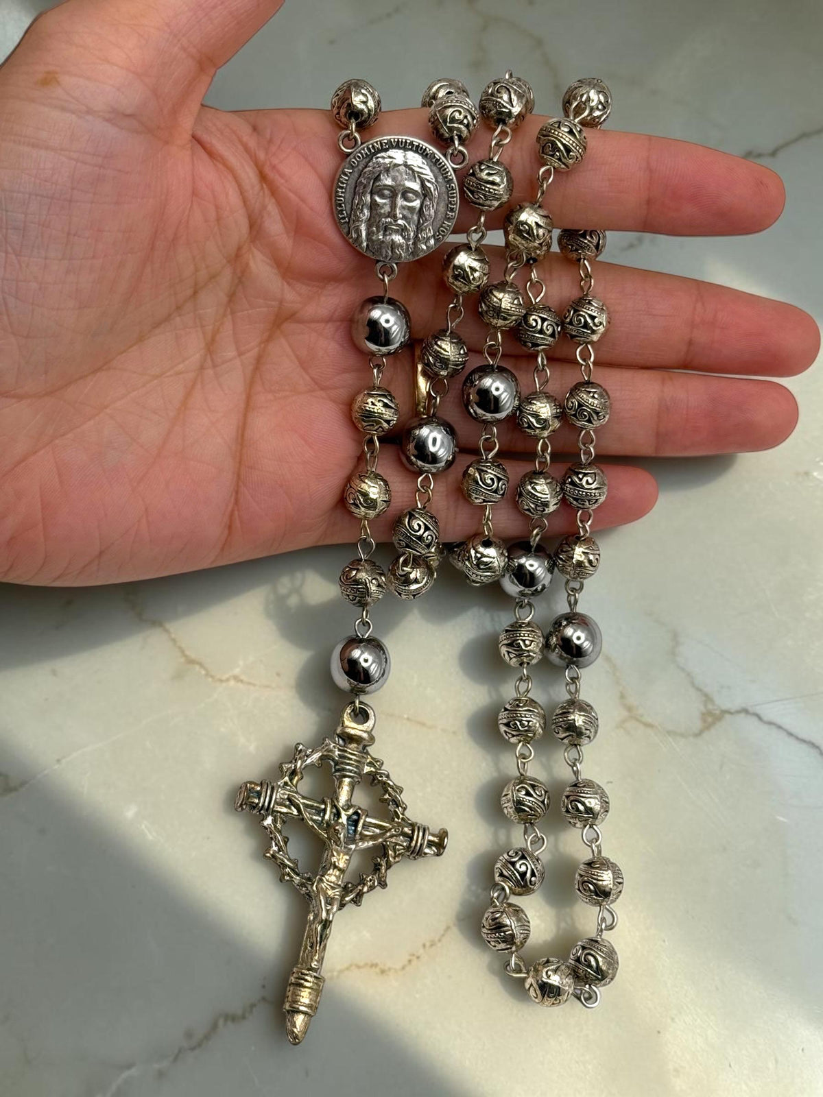 Holy Face Hematite Rosary detail view