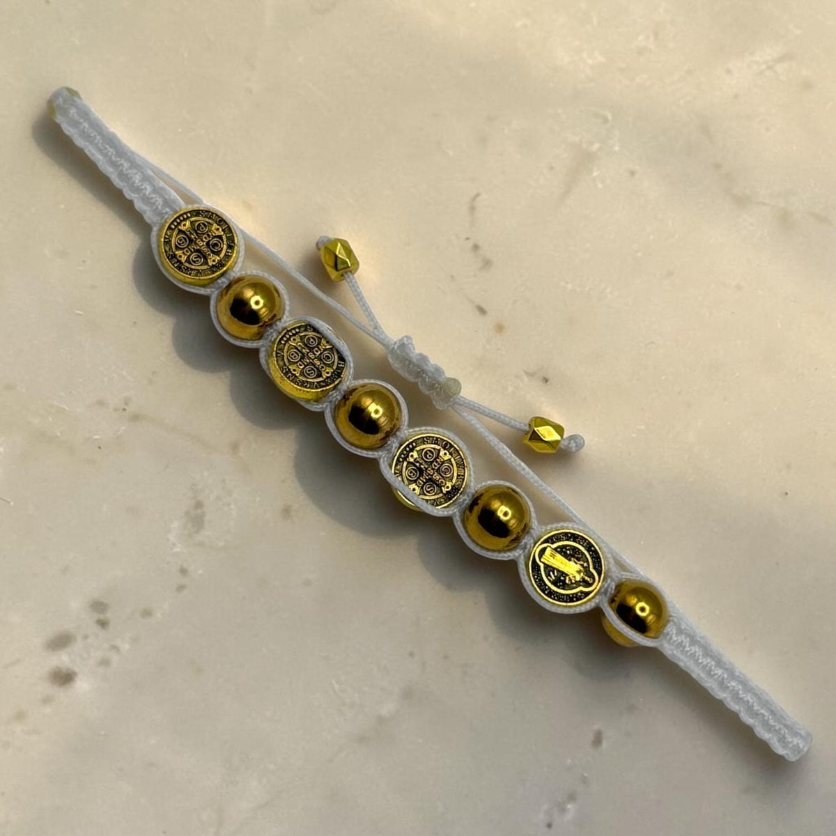 Gold St. Benedict Medal bracelet detail view