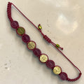 Pink cord Catholic bracelet with translucent pink beads and gold Saint Benedict medals