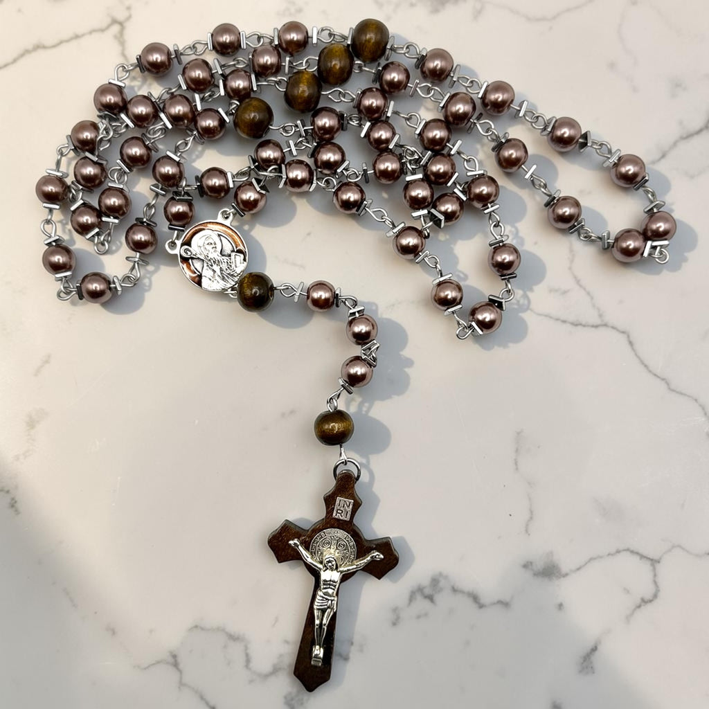 Purple pearl and wood Saint Benedict rosary detail view