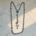 Dark gray hematite Catholic rosary with striped glass Our Father beads and Holy Night Nativity centerpiece