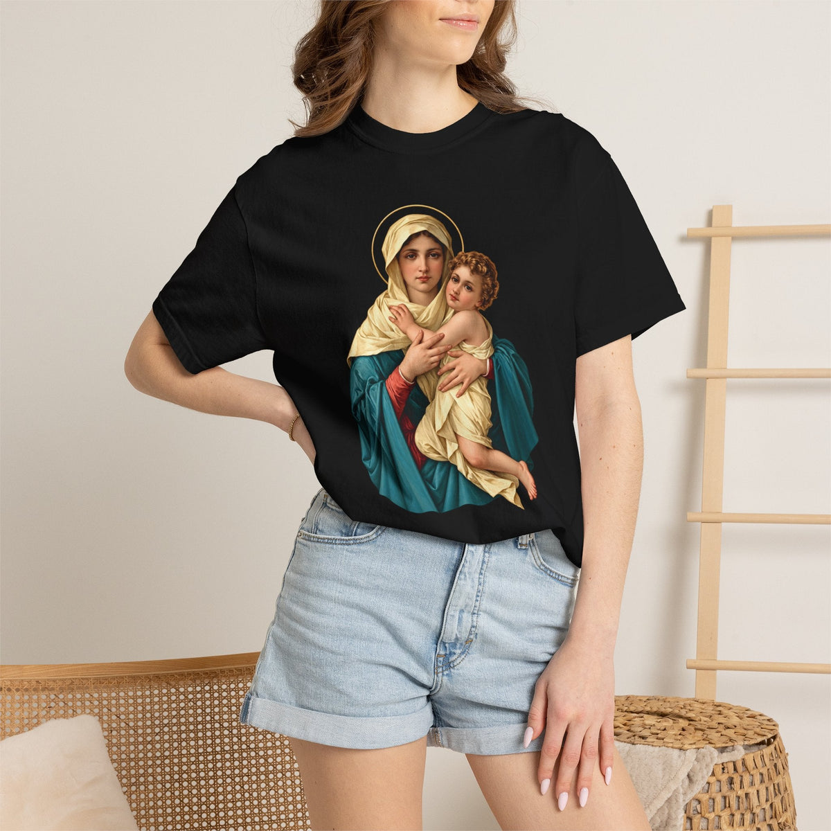 Sacred Armor Rosaries black Comfort Colors t-shirt featuring a vibrant Our Lady of Schoenstatt print on a woman