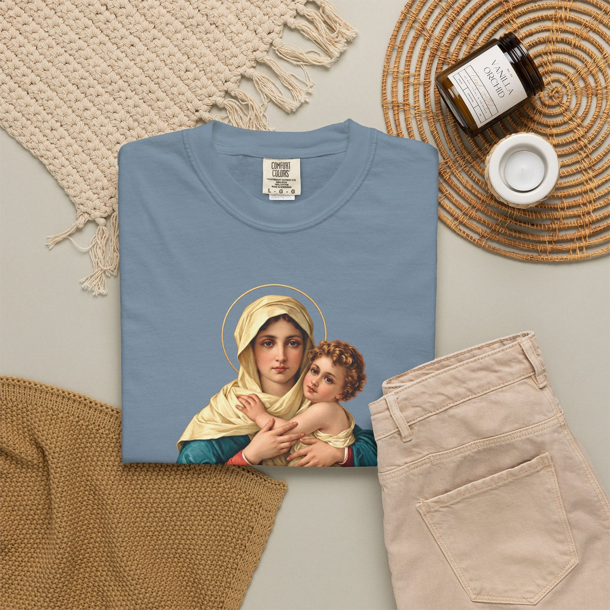 Sacred Armor Rosaries blue Comfort Colors t-shirt featuring a vibrant print of Our Lady of Schoenstatt and Child Jesus