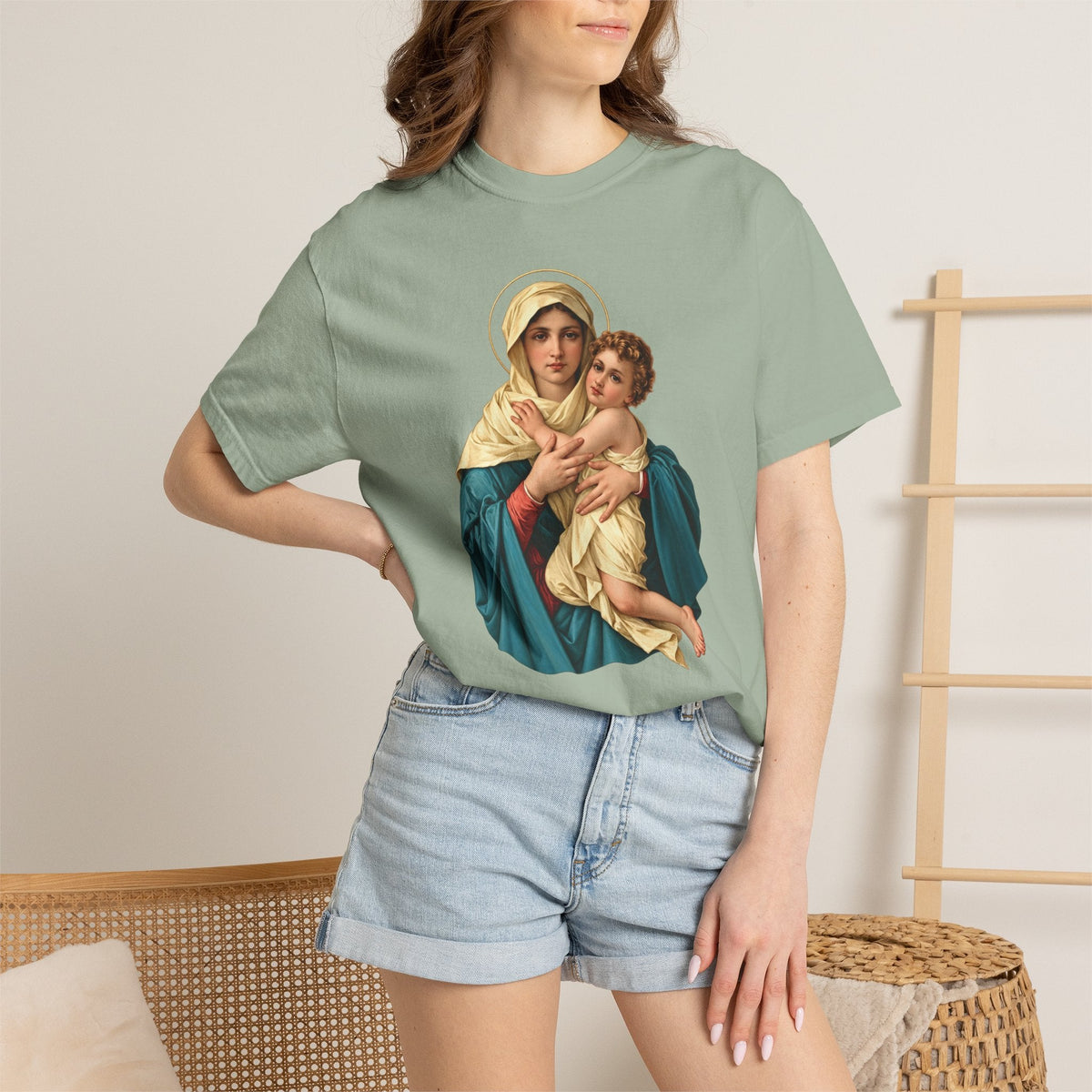 Sacred Armor Rosaries Comfort Colors t-shirt in sage green featuring a vibrant Our Lady of Schoenstatt print.