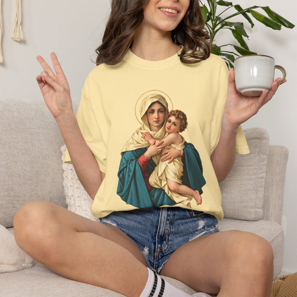 Sacred Armor Rosaries yellow Comfort Colors t-shirt featuring a vibrant Our Lady of Schoenstatt print on a woman