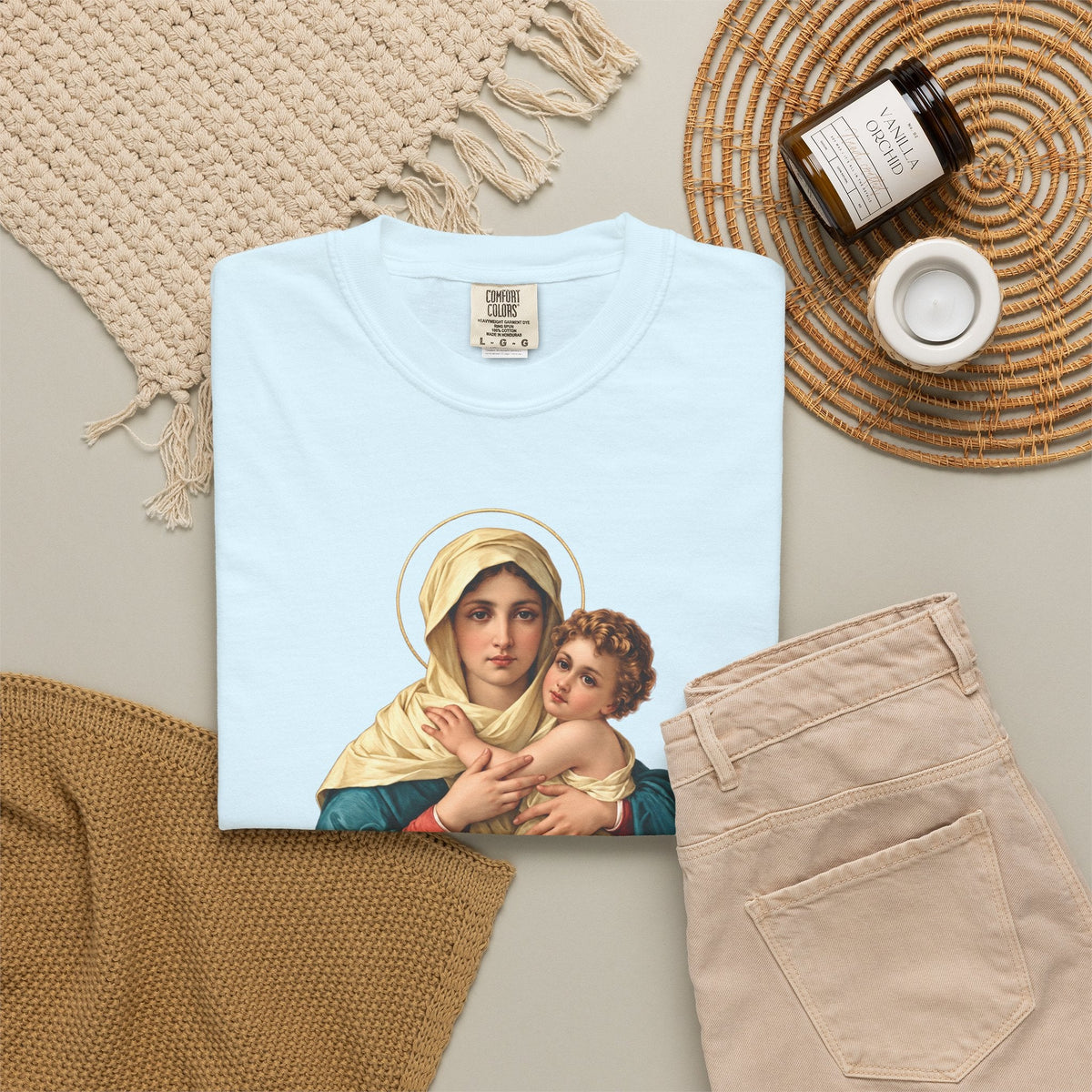 Sacred Armor Rosaries light blue Comfort Colors t-shirt featuring a devotional print of Our Lady of Schoenstatt.