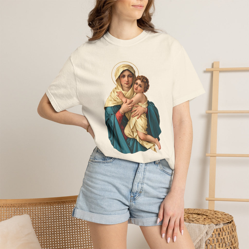 Sacred Armor Rosaries cream Comfort Colors t-shirt featuring a vibrant Our Lady of Schoenstatt print on a woman