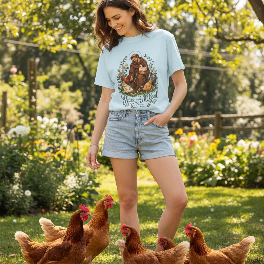 Woman wearing light blue St. Francis of Assisi Peace and All Good T-shirt with chickens